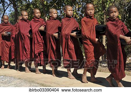 "Buddhist monks collecting alms, Full Moon Festival in December, Nyaung Shwe, Shan State, Myanmar, Burma, Asia" View Large Photo Image Picture - "Buddhist monks collecting alms, Full Moon Festival in December, Nyaung Shwe, Shan State, Myanmar, Burma, Asia". Fotosearch
