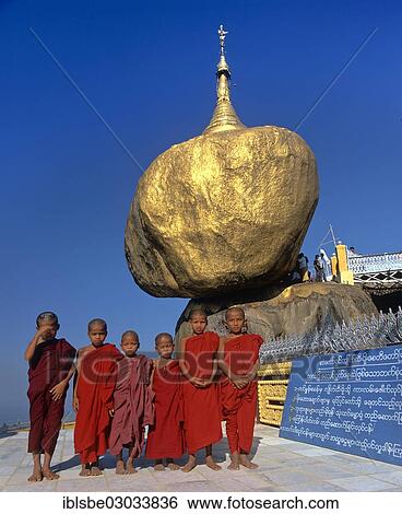 "Buddhist monks, novices standing in front of the Golden Rock or Kyaiktiyo Pagoda, Kyaikto, Mon-Staat, Myanmar, Burma, Asia" View Large Photo Image Stock Photograph - "Buddhist monks, novices standing in front of the Golden Rock or Kyaiktiyo Pagoda, Kyaikto, Mon-Staat, Myanmar, Burma, Asia". Fotosearch