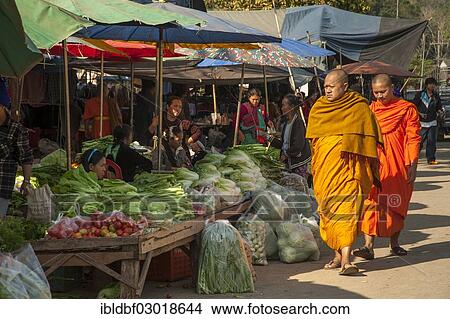 Picture - "Buddhist monks while shopping, vegetable stand, morning market, Soppong oder Pang Mapha, Provinz Mae Hong Son, Thailand, Asia". Fotosearch