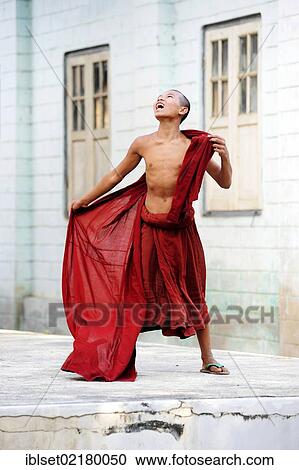 "Buddhist novice looking up and being happy in a monastery, Myanmar, Burma, Southeast Asia, Asia" View Large Photo Image Stock Image - "Buddhist novice looking up and being happy in a monastery, Myanmar, Burma, Southeast Asia, Asia". Fotosearch