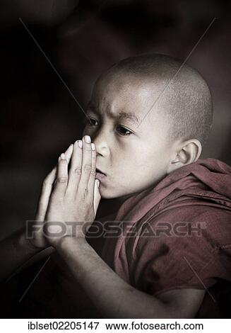"Buddhist novice praying, Bagan, Burma, Myanmar, Southeast Asia, Asia" View Large Photo Image Stock Photo - "Buddhist novice praying, Bagan, Burma, Myanmar, Southeast Asia, Asia". Fotosearch