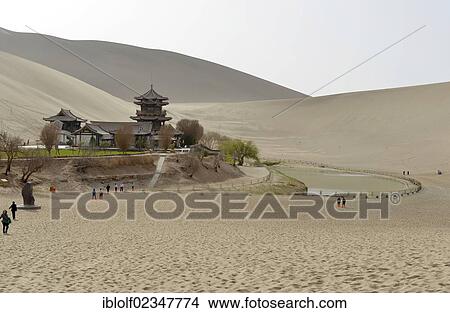 Picture - "Buddhist pagoda in the sand dunes of the Gobi Desert on Crescent Lake and Mount Mingshan near Dunhuang, Silk Road, Gansu, China, Asia". Fotosearch