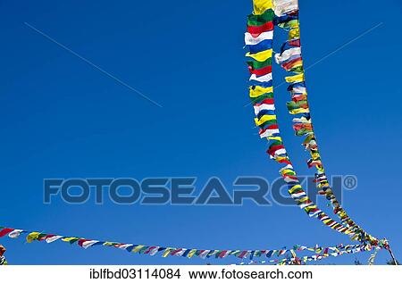 "Buddhist prayer flags in front of blue sky above Namche Bazar (3. 440 m), the base for trekking and mountaineering in Solo Khumbu region, Namche Bazar, Solukhumbu District, Sagarmatha Zone, Nepal, Asia" View Large Photo Image Picture - "Buddhist prayer flags in front of blue sky above Namche Bazar (3. 440 m), the base for trekking and mountaineering in Solo Khumbu region, Namche Bazar, Solukhumbu District, Sagarmatha Zone, Nepal, Asia". Fotosearch