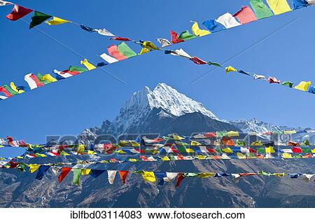 "Buddhist prayer flags in front of Kangtega Mountain above Namche Bazar (3. 440 m), the base for trekking and mountaineering in Solo Khumbu region, Namche Bazar, Solukhumbu District, Sagarmatha Zone, Nepal, Asia" View Large Photo Image Stock Image - "Buddhist prayer flags in front of Kangtega Mountain above Namche Bazar (3. 440 m), the base for trekking and mountaineering in Solo Khumbu region, Namche Bazar, Solukhumbu District, Sagarmatha Zone, Nepal, Asia". Fotosearch