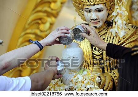 "Buddhists during the ritual washing of a Buddha statue, Shwedagon Pagoda, Yangon, Burma also known as Myanmar, Southeast Asia, Asia" View Large Photo Image Stock Photograph - "Buddhists during the ritual washing of a Buddha statue, Shwedagon Pagoda, Yangon, Burma also known as Myanmar, Southeast Asia, Asia". Fotosearch