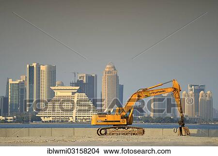 "Building boom in Doha, Hyundai excavator in front of the skyline, Hotel Doha Sheraton, Four Seasons Hotel, Falcon and Pearl Towers, Doha, Doha, Qatar, Asia" View Large Photo Image Picture - "Building boom in Doha, Hyundai excavator in front of the skyline, Hotel Doha Sheraton, Four Seasons Hotel, Falcon and Pearl Towers, Doha, Doha, Qatar, Asia". Fotosearch