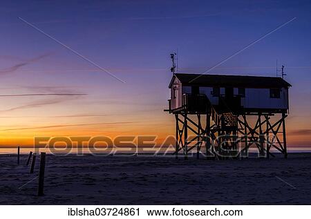 "Building on stilts on the beach at sunset, St. Peter-Ording, Eiderstedt, North Frisia, Schleswig-Holstein, Germany, Europe" View Large Photo Image Stock Image - "Building on stilts on the beach at sunset, St. Peter-Ording, Eiderstedt, North Frisia, Schleswig-Holstein, Germany, Europe". Fotosearch