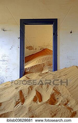 "Building taken over by sand from the desert, former diamond mining town, now a ghost town, Kolmanskop, Luderitz, Karas Region, Namibia, Africa" View Large Photo Image Stock Image - "Building taken over by sand from the desert, former diamond mining town, now a ghost town, Kolmanskop, Luderitz, Karas Region, Namibia, Africa". Fotosearch
