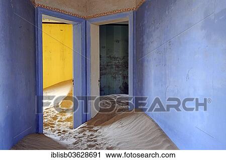 Stock Image - "Building taken over by sand from the desert, former diamond mining town, now a ghost town, Kolmanskop, Luderitz, Karas Region, Namibia, Africa". Fotosearch