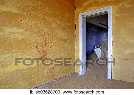 Stock Image - "Building taken over by sand from the desert, former diamond mining town, now a ghost town, Kolmanskop, Luderitz, Karas Region, Namibia, Africa". Fotosearch
