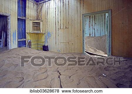 Stock Photo - "Building taken over by sand from the desert, former diamond mining town, now a ghost town, Kolmanskop, Luderitz, Karas Region, Namibia, Africa". Fotosearch