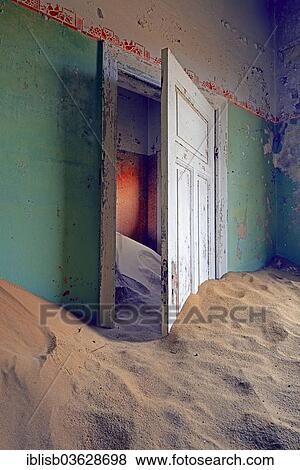 "Building taken over by sand from the desert, former diamond mining town, now a ghost town, Kolmanskop, Luderitz, Karas Region, Namibia, Africa" View Large Photo Image Stock Photo - "Building taken over by sand from the desert, former diamond mining town, now a ghost town, Kolmanskop, Luderitz, Karas Region, Namibia, Africa". Fotosearch