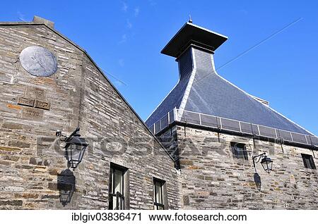 Stock Image - "Building with the typical tower of a whiskey distillery, Highland Park Distillery, Kirkwall, Mainland, Orkney, Scotland, United Kingdom, Europe". Fotosearch
