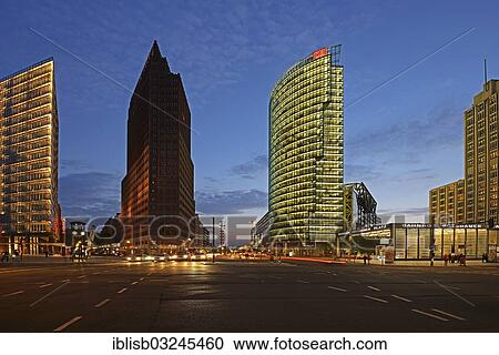 Stock Image - "Buildings of the Daimler Areal, left, Bahnturm Tower and the Beisheim Center, right, on Potsdamer Platz square, at dusk, Mitte, Berlin, Berlin, Germany, Europe". Fotosearch