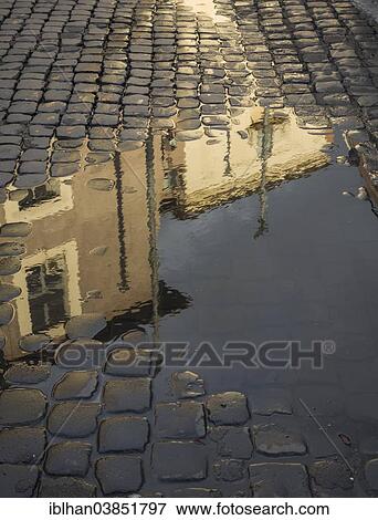Stock Photo - "Buildings reflected in a puddle, Piazza della Republica, Rome, Lazio, Italy, Europe". Fotosearch