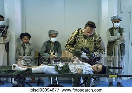 "Bundeswehr doctor treating an Afghan boy in PRT Feyzabad, a field hospital of the Federal Defence Forces of Germany, Feyzabad, Feyzabad, Afghanistan, Asia" View Large Photo Image Stock Photo - "Bundeswehr doctor treating an Afghan boy in PRT Feyzabad, a field hospital of the Federal Defence Forces of Germany, Feyzabad, Feyzabad, Afghanistan, Asia". Fotosearch