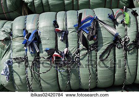 Picture - Bundled package with coloured markers, packed for loading on Dubai Creek, Dubai, United Arab Emirates, Middle East, Asia. Fotosearch