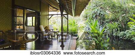 "Bungalow with a verandah, The Watergarden Hotel, Candi Dasa, Bali, Indonesia, Asia" View Large Photo Image Stock Photograph - "Bungalow with a verandah, The Watergarden Hotel, Candi Dasa, Bali, Indonesia, Asia". Fotosearch
