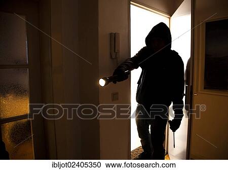 Burglar entering an apartment View Large Photo Image Stock Image - Burglar entering an apartment. Fotosearch