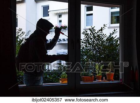 Burglar prying open a window with a screwdriver broad daylight View Large Photo Image Stock Photo - Burglar prying open a window with a screwdriver broad daylight. Fotosearch