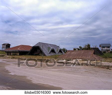 Stock Image - "Buried houses and a school in Porac, Mt Pinatubo, lahar fields, lahar, mudstream, pyroclastic flow, Porac / Mancatian, Pampanga, Luzon, Philippines, Asia". Fotosearch