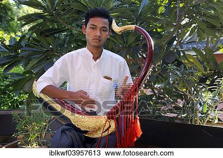 "Burmese man playing the Saung Gauk, Burmese harp or arched harp, national instrument of Myanmar, Bagan, Mandalay Region, Myanmar, Asia" View Large Photo Image Stock Image - "Burmese man playing the Saung Gauk, Burmese harp or arched harp, national instrument of Myanmar, Bagan, Mandalay Region, Myanmar, Asia". Fotosearch