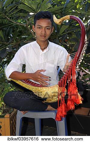 "Burmese man playing the Saung Gauk, Burmese harp or arched harp, national instrument of Myanmar, Bagan, Mandalay Region, Myanmar, Asia" View Large Photo Image Stock Photograph - "Burmese man playing the Saung Gauk, Burmese harp or arched harp, national instrument of Myanmar, Bagan, Mandalay Region, Myanmar, Asia". Fotosearch