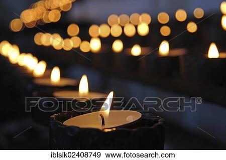 Stock Photo - "Burning candles in a church, Otterswang, Upper Swabia, Baden-Wuerttemberg, Germany, Europe". Fotosearch