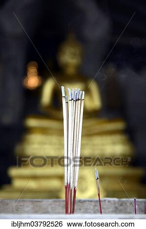 "Burning incense sticks in front of a Buddha statue, Wat Traimit Temple, Bangkok, Thailand, Asia" View Large Photo Image Stock Photograph - "Burning incense sticks in front of a Buddha statue, Wat Traimit Temple, Bangkok, Thailand, Asia". Fotosearch