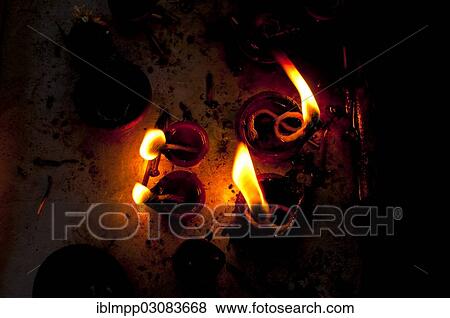 Burning oil lamps in an Indian temple View Large Photo Image Stock Photo - Burning oil lamps in an Indian temple. Fotosearch