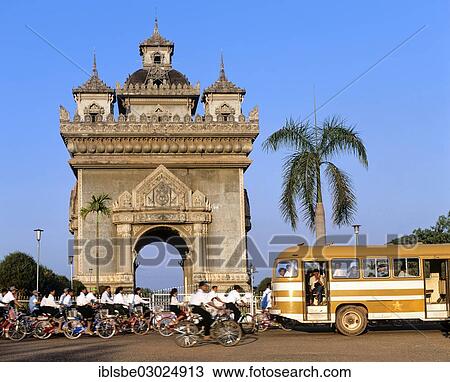 "Bus and many cyclists passing Patou Xai triumphal arch, Xang Boulevard, Vientiane, Vientiane Province, Laos, Asia" View Large Photo Image Stock Image - "Bus and many cyclists passing Patou Xai triumphal arch, Xang Boulevard, Vientiane, Vientiane Province, Laos, Asia". Fotosearch