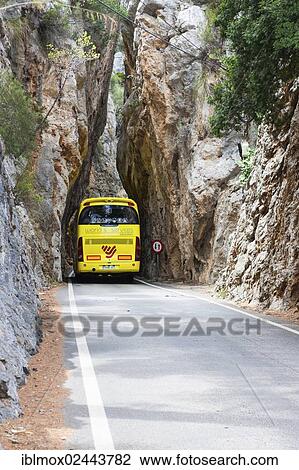 "Bus driving through a narrow tunnel along the winding mountain road to Sa Calobra, Tramuntana Mountains, Majorca, Balearic Islands, Spain, Europe" View Large Photo Image Stock Image - "Bus driving through a narrow tunnel along the winding mountain road to Sa Calobra, Tramuntana Mountains, Majorca, Balearic Islands, Spain, Europe". Fotosearch