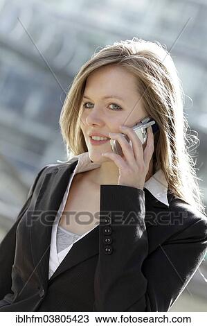 "Business woman using a mobile phone, Lower Saxony, Germany, Europe" View Large Photo Image Stock Image - "Business woman using a mobile phone, Lower Saxony, Germany, Europe". Fotosearch