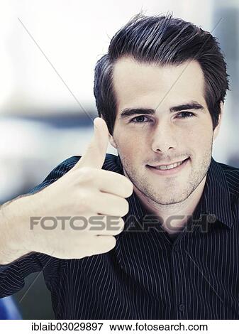 Stock Photo - Businessman giving thumbs-up. Fotosearch