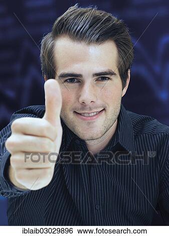 Businessman giving thumbs-up View Large Photo Image Stock Photograph - Businessman giving thumbs-up. Fotosearch