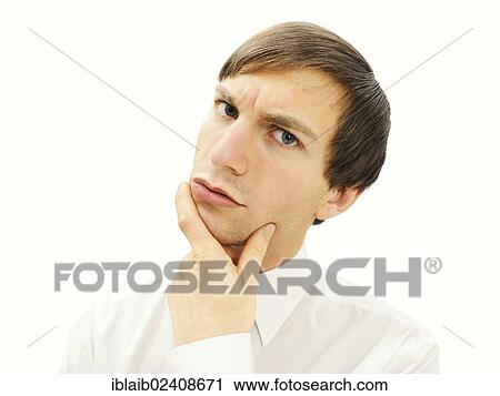 Stock Image - "Businessman with a serious face, pensive, portrait". Fotosearch