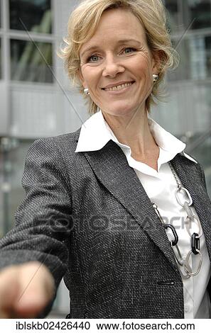 "Businesswoman, 40-50, with an outstretched hand" View Large Photo Image Stock Image - "Businesswoman, 40-50, with an outstretched hand". Fotosearch