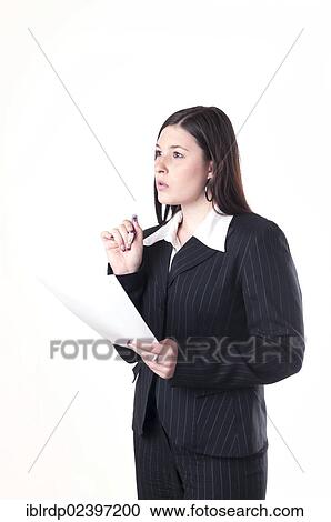 "Businesswoman holding a pen and a letter, pondering" View Large Photo Image Stock Image - "Businesswoman holding a pen and a letter, pondering". Fotosearch
