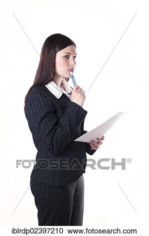 "Businesswoman holding a pen and a letter, pondering" View Large Photo Image Stock Image - "Businesswoman holding a pen and a letter, pondering". Fotosearch