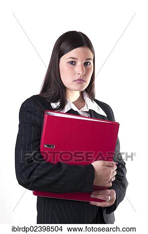 Picture - Businesswoman holding a red folder in her arm. Fotosearch