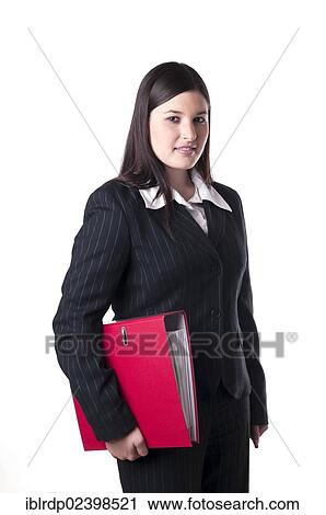 Stock Image - Businesswoman holding a red folder under her arm. Fotosearch