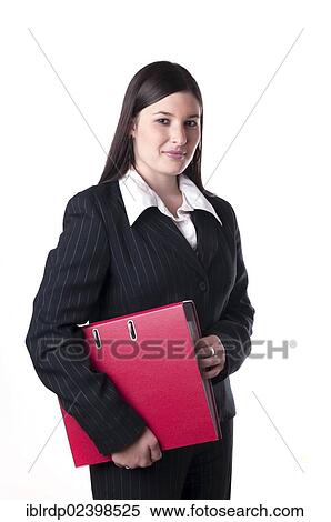 Businesswoman holding a red folder under her arm View Large Photo Image Stock Photography - Businesswoman holding a red folder under her arm. Fotosearch