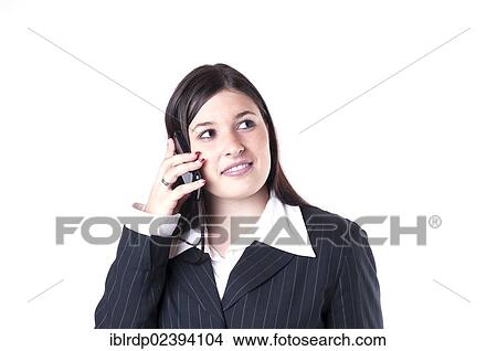 Picture - "Businesswoman on the phone, looking friendly". Fotosearch