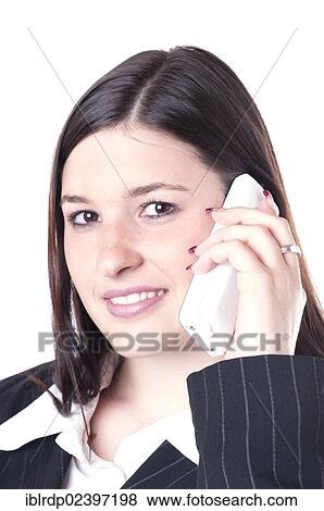 Stock Photo - "Businesswoman on the phone, looking friendly". Fotosearch
