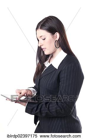 Businesswoman using a tablet PC View Large Photo Image Stock Photography - Businesswoman using a tablet PC. Fotosearch