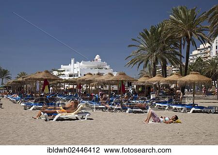 Stock Image - "Busy beach, Marbella, Costa del Sol, Andalusia, Spain, Europe, PublicGround, Europe". Fotosearch