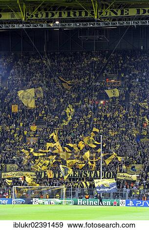 Stock Photo - "BVB fans in the south stand waving their flags before the start of the game, UEFA Champions League, Borussia Dortmund - Ajax Amsterdam 1: 0, Signal Iduna Park, Dortmund, North Rhine-Westphalia, Germany, Europe". Fotosearch