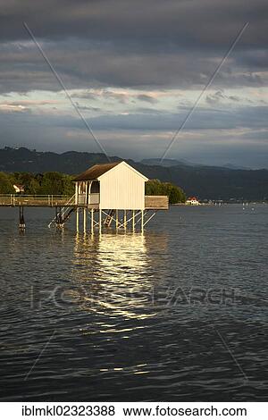 Stock Photo - "Cabana in the evening light on the shore of Wasserburg peninsula, Lake Constance, Bavaria, Germany, Europe". Fotosearch