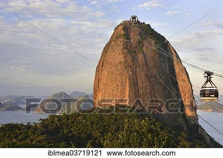 Stock Image - "Cablecar with a gondola at the Sugarloaf Mountain or Pao de Acucar, evening mood, Rio de Janeiro, Rio de Janeiro State, Brazil, South America". Fotosearch