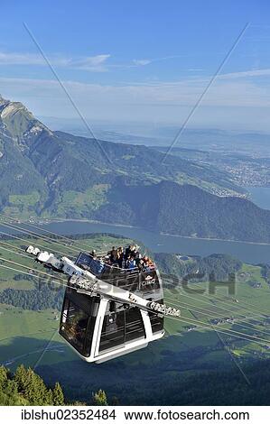 "CabriO Bahn, the world's first cable car with an open top deck, going up Stanserhorn Mountain, Stans, Switzerland, Europe" View Large Photo Image Picture - "CabriO Bahn, the world's first cable car with an open top deck, going up Stanserhorn Mountain, Stans, Switzerland, Europe". Fotosearch